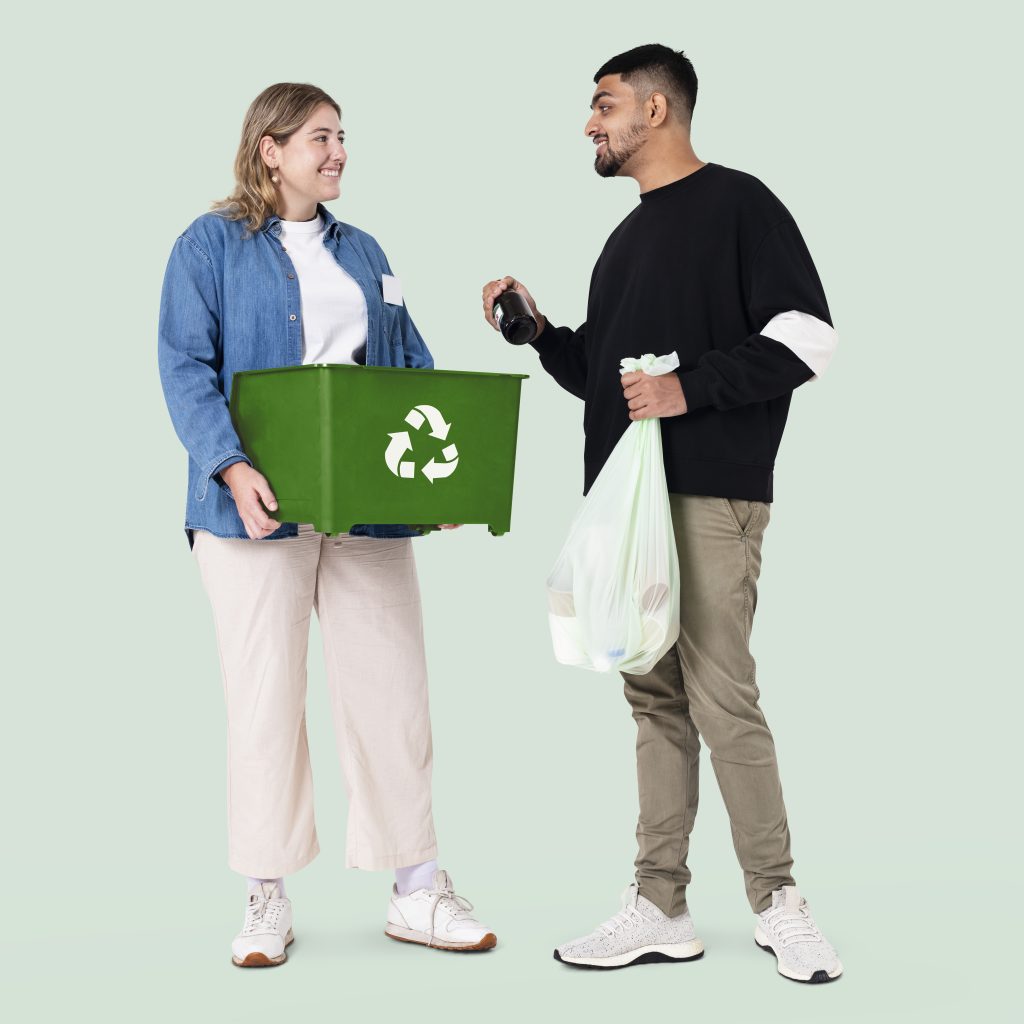 Beach cleanup volunteer with recycle bin save the earth campaign